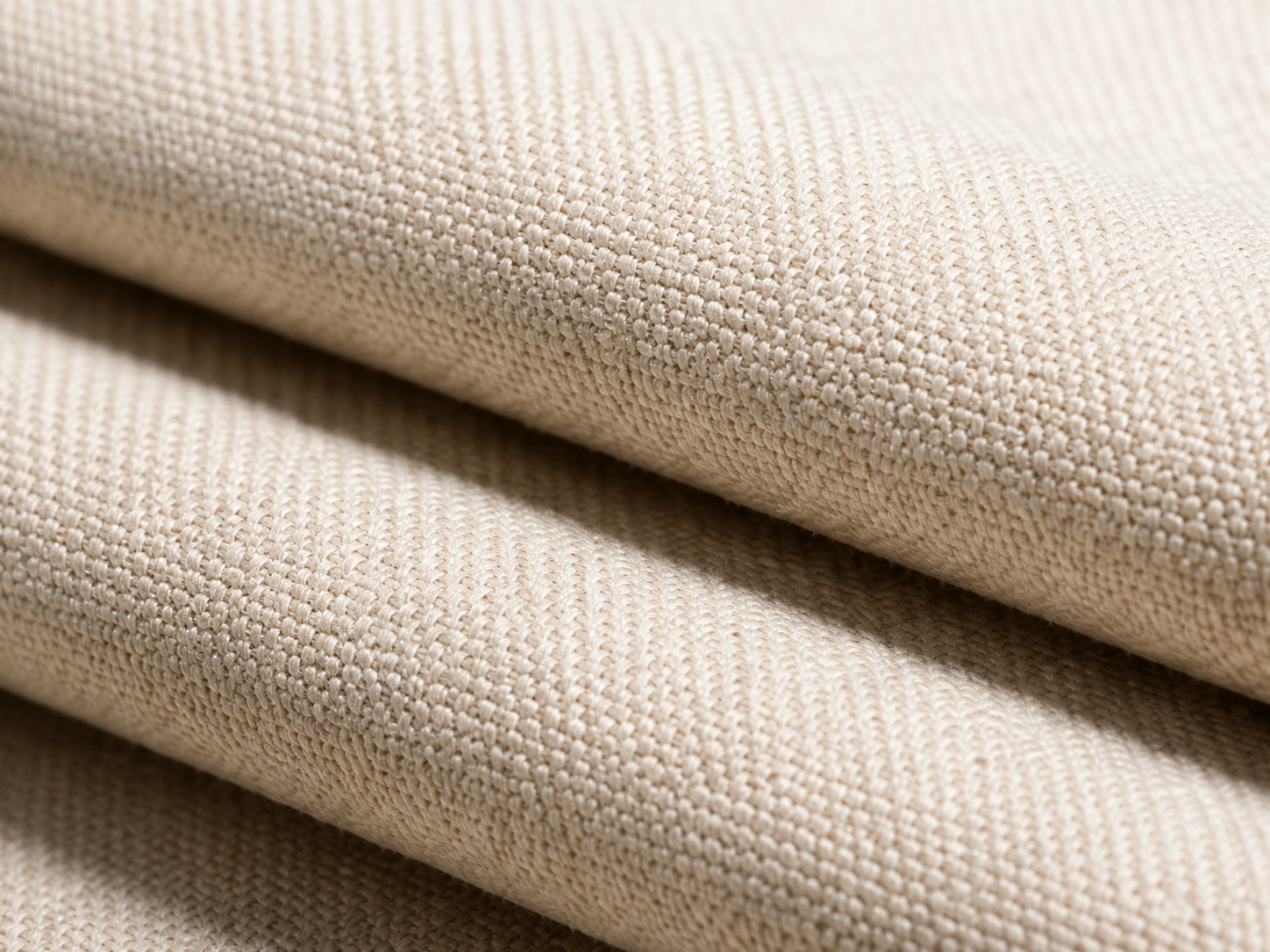 Macro study of natural cotton canvas weave and folded edge