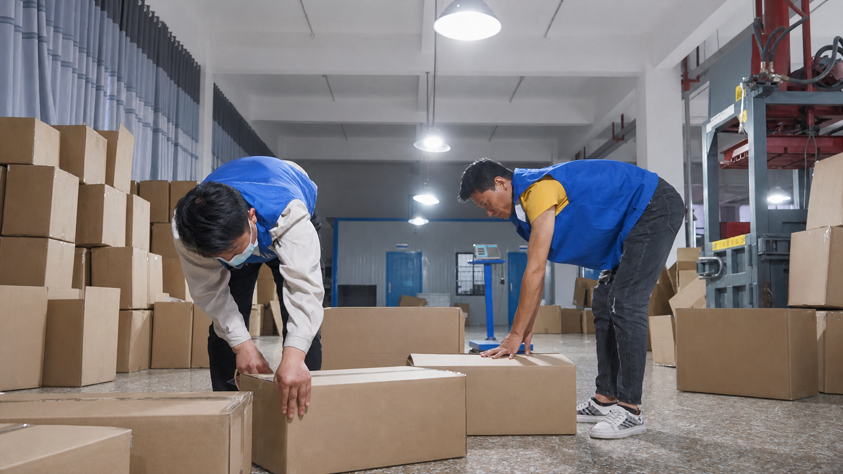 Staff preparing shipping cartons in an affiliated packing area